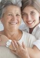 Smiling grandmother and granddaughter share a loving embrace, symbolizing the special bond between mothers and daughters.