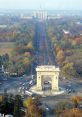 Arc de Triomphe in Bucharest, Romania, surrounded by autumn foliage and busy traffic, showcasing the vibrant city landscape.