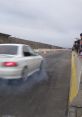 White car speeding down a racetrack, leaving tire smoke, with spectators watching from the side. Excitement in the air.