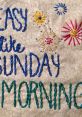 Embroidered design featuring the phrase 'Easy like Sunday morning' with colorful flowers and text.