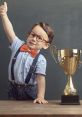 Cheerful boy in glasses gives a thumbs-up next to a shiny trophy, celebrating his winning moment with joy.