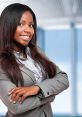 Confident woman in a suit proudly showcasing self-assurance and empowerment in a professional setting.