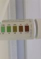 Ketone test strip with color chart indicating levels from 0.1% to 2% for accurate ketone measurement in urine.