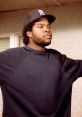 Doughboy from "Boyz n the Hood" wearing a Detroit cap and oversized sweatshirt, embodying street culture and resilience.