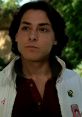 Mike Damone from "Fast Times at Ridgemont High," showcasing his confident style and charm in a casual setting.