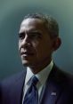 Barack Obama in a dark suit with a blue and white striped tie, showcasing a thoughtful expression and presidential demeanor.