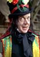 Child Catcher from Chitty Chitty Bang Bang, displaying a sinister smile and colorful attire with a large hat adorned with flowers.