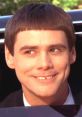 Lloyd Christmas smiles brightly from a car, showcasing his iconic bowl cut in the classic comedy "Dumb & Dumber.