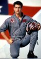 Maverick from Top Gun kneels confidently in flight gear, showcasing his iconic helmet and intense demeanor.