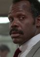 Roger Murtaugh's intense expression in Lethal Weapon, showcasing his iconic role as a seasoned detective.