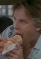 Angelo Pappas enjoying a sandwich in the classic movie "Point Break," showcasing his laid-back attitude.