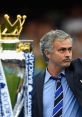 Jose Mourinho celebrates with the Premier League trophy, highlighting his successful reign at Chelsea FC.