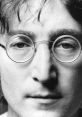 Close-up portrait of John Lennon, featuring his iconic round glasses and thoughtful expression, capturing his artistic essence.