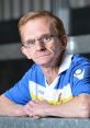 Gordon Hill, known as The Wealdstone Raider, poses confidently in a vibrant football jersey, showcasing his passion for the game.