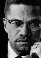 Portrait of Malcolm X showcasing his determined expression, wearing glasses and a notable ring, symbolizing his legacy.