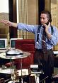 Gordon Gekko on the phone in his office, embodying the power and ambition of Wall Street's financial elite.