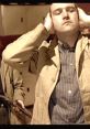 Man covering his ears in a tense moment, featuring a scene inspired by "Lock, Stock and Two Smoking Barrels.