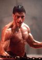 Kurt Sloane, the fierce kickboxer, showcases intense determination with a muscular physique in a training scene.