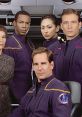 Main cast of Star Trek: Enterprise in uniforms, showcasing diverse characters aboard the starship. Bold and dynamic sci-fi setting.