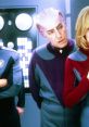 Classic scene from "Galaxy Quest" featuring iconic characters in colorful space uniforms, showcasing their unique alien looks.