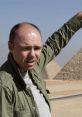 Karl Pilkington visiting the Pyramids of Giza in "An Idiot Abroad," showcasing his unique travel experiences and humor.