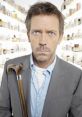 Dr. Gregory House, M.D. stands with a cane, showcasing his intense expression against a backdrop of medicine bottles.