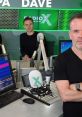 Chris Moyles hosting at Radio X studio, with team members and equipment visible in a vibrant broadcasting environment.