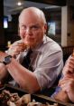 Hitchcock enjoying a messy meal, showcasing his humorous side in Brooklyn Nine-Nine's comedic moments.