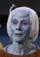 Blue-skinned alien character from Star Trek, featuring unique facial features and distinctive light-colored hair.