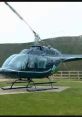 Black helicopter on a grassy field, showcasing the sleek design and rotor blades. Ideal for helicopter effects demonstrations.