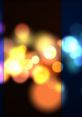 Vibrant bokeh lights in ambient colors create a mesmerizing background effect, ideal for creative projects and designs.