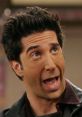 Ross Geller from Friends expresses surprise with an animated facial expression, showcasing his comedic personality.