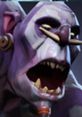 Witch Doctor from Dota displaying intense expression, featuring unique purple skin and tribal accessories.