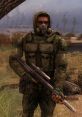 Freedom faction soldier in STALKER, camouflaged, armed with a rifle, set in a desolate landscape.