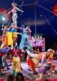 Colorful circus performers executing an acrobatic human pyramid under the big top, showcasing vibrant costumes and teamwork.