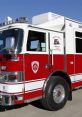 Red and white emergency vehicle with clear markings, designed for ambulance or fire rescue operations, parked outdoors.