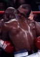 Mike Tyson biting Evander Holyfield during their infamous boxing match, highlighting a controversial moment in sports history.