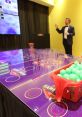 Host your own game show setup with a vibrant table, green balls, and a presenter in a stylish venue. Fun and engaging experience!