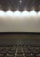 Spacious movie theatre interior with empty seats and a large screen, ready for the next blockbuster film showing.