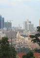 Skyline of Kampala, Uganda, featuring modern buildings and a prominent temple among urban development.