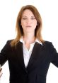 Confident woman in a suit with books, looking directly at the viewer, embodying strength and determination in her stance.