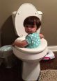 Toddler sitting on a toilet, showcasing a humorous and cute moment in kids' potty training adventures.