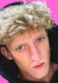 Faze Tfue with curly hair and intense gaze, set against a vibrant pink background, showcasing his unique style.