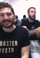 Two Funhaus hosts laughing and engaging playfully in a gaming setup, showcasing their entertaining dynamic.