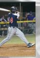 Player in Victory 2020 Baseball gear swinging a bat, showcasing athleticism and focus during a night game.