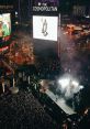 Crowd enjoying an electrifying performance at The Cosmopolitan during Playlist 1738, with vibrant lights and smoke effects.