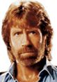 Close-up of Chuck Norris with a rugged look, iconic hairstyle, showcasing his strong persona in martial arts and film.