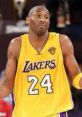 Kobe Bryant in a Lakers jersey, #24, displaying a playful expression during a game. Iconic NBA moment captured.