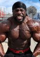 Kali Muscle showcasing impressive muscle definition and intensity during outdoor workout session, embodying fitness motivation.