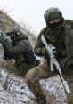 Spetsnaz operatives in tactical gear, navigating a snowy landscape while armed and vigilant during a training exercise.